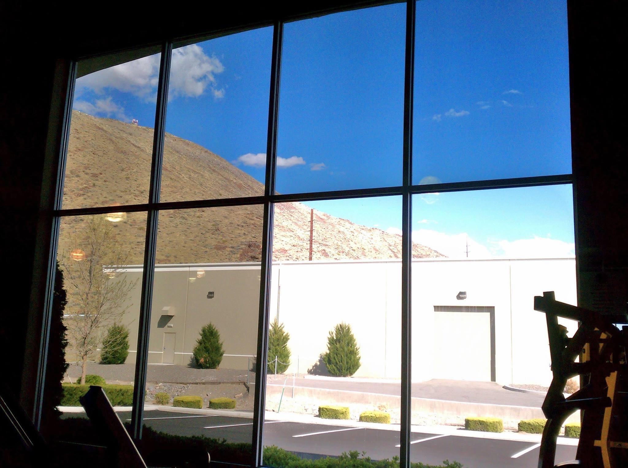 Commercial solar control window film installation on business windows in Delaware