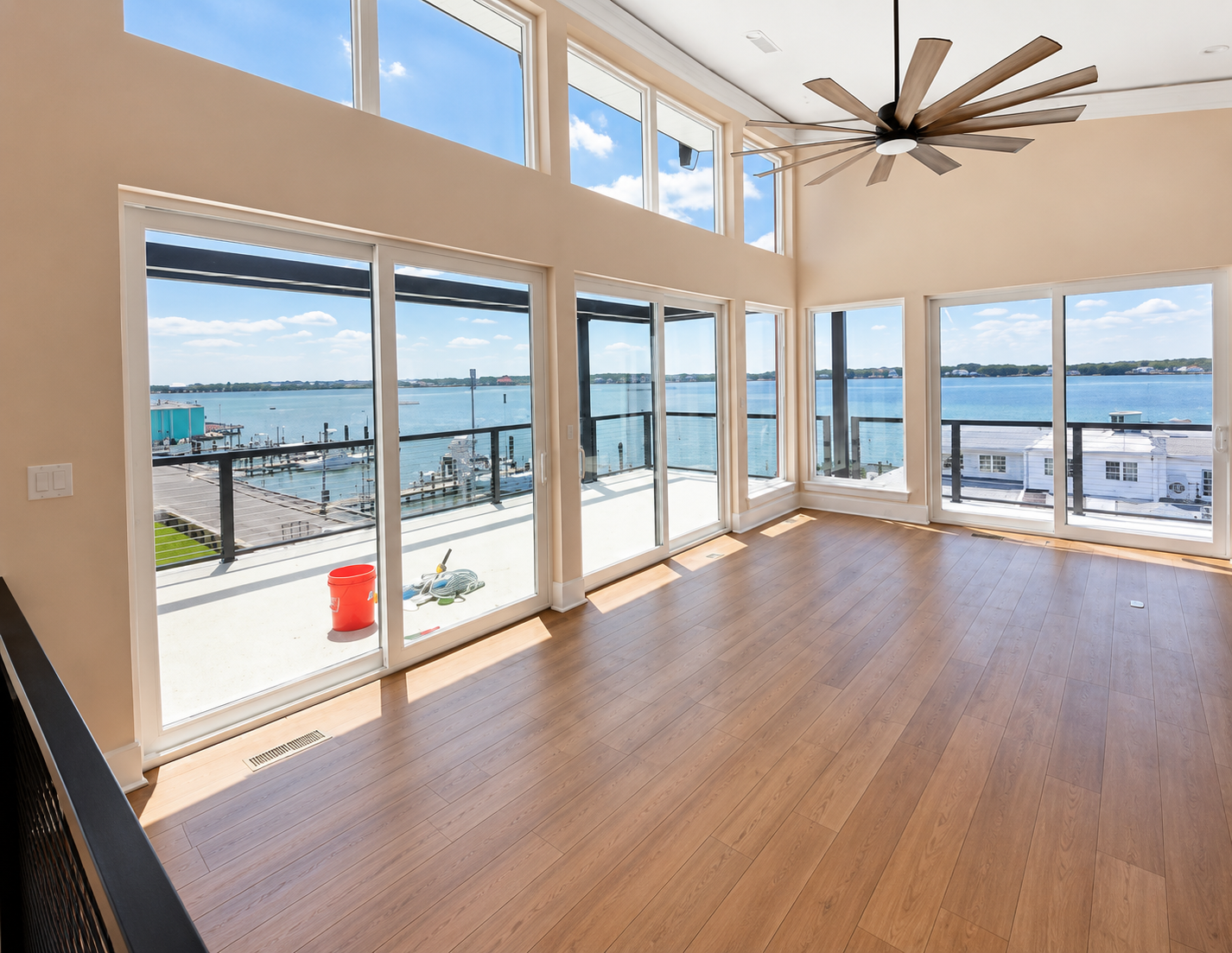 Floor-to-ceiling tinted windows overlooking the bay in a Delaware beach home